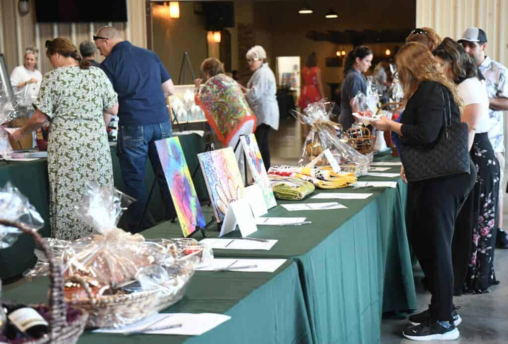 Photo Attendees place bids on a wide variety of silent auction items during the 2023 O.L.I.V.E. Foundation’s annual dinner/auction fundraiser. This year’s event will be held in Hatfield Hall at the Madera Fairgrounds.