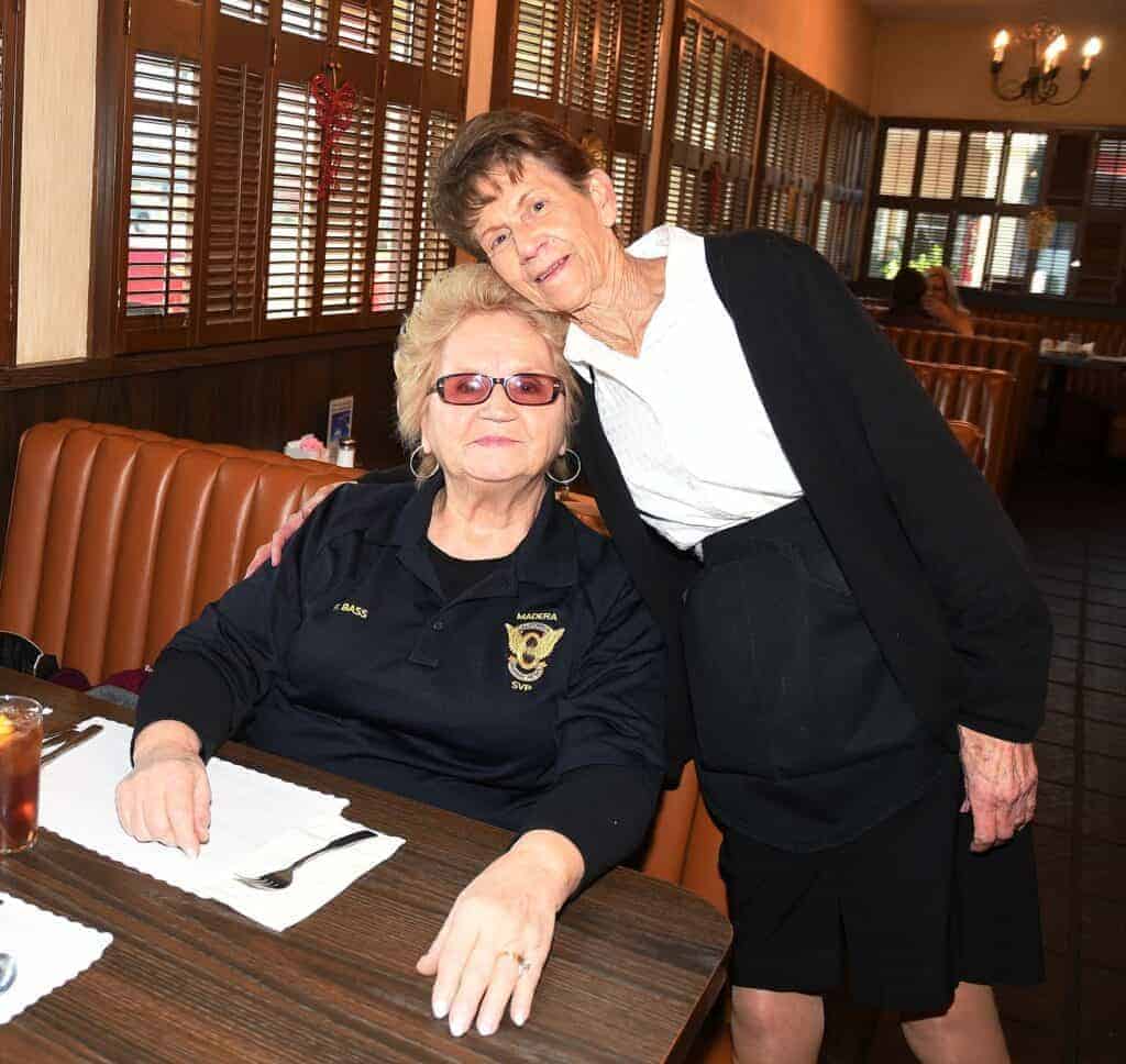Photo - Farnesi’s server Anna McKenzie hugs longtime patron and friend, Fran Bass, at the restaurant. McKenzie is retiring after more than 43 years working at the establishment.