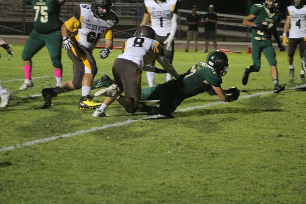 Photo - Liberty’s Dominic Castaneda drives into the end zone for a touchdown in Friday’s 40-20 victory over the Golden West Trailblazers. Castaneda rushed for a season-high 143 yards in the win.