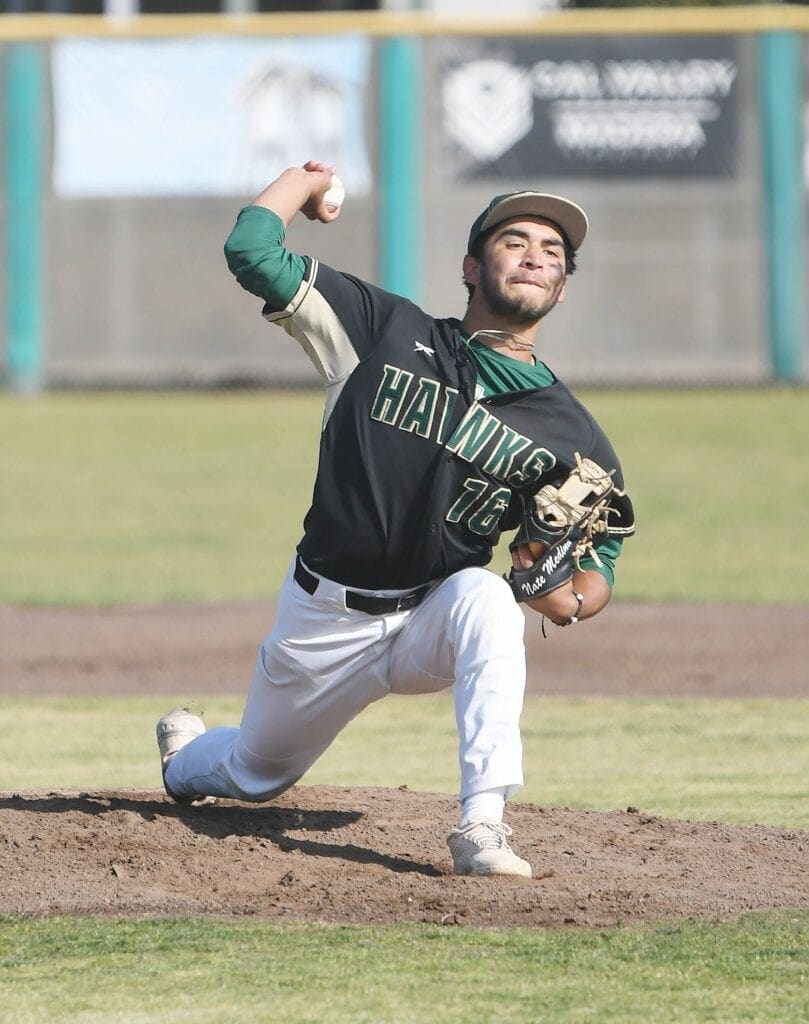 Photo - Liberty’s Nate Medina throws a pitch to the Yosemite Badgers on Friday He allowed just three hits over six innings during a 12-0 victory at Liberty.