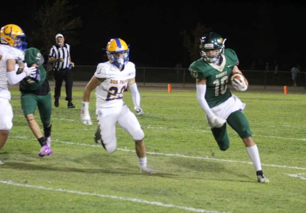 Photo - Liberty’s Jacob Rogers-Lehman turns the corner during a 60-yard touchdown run during Friday’s loss to the Dos Palos Broncos. Rogers-Lehman rushed for a career high 120 yards on 12 carries and scored two touchdowns in the loss.