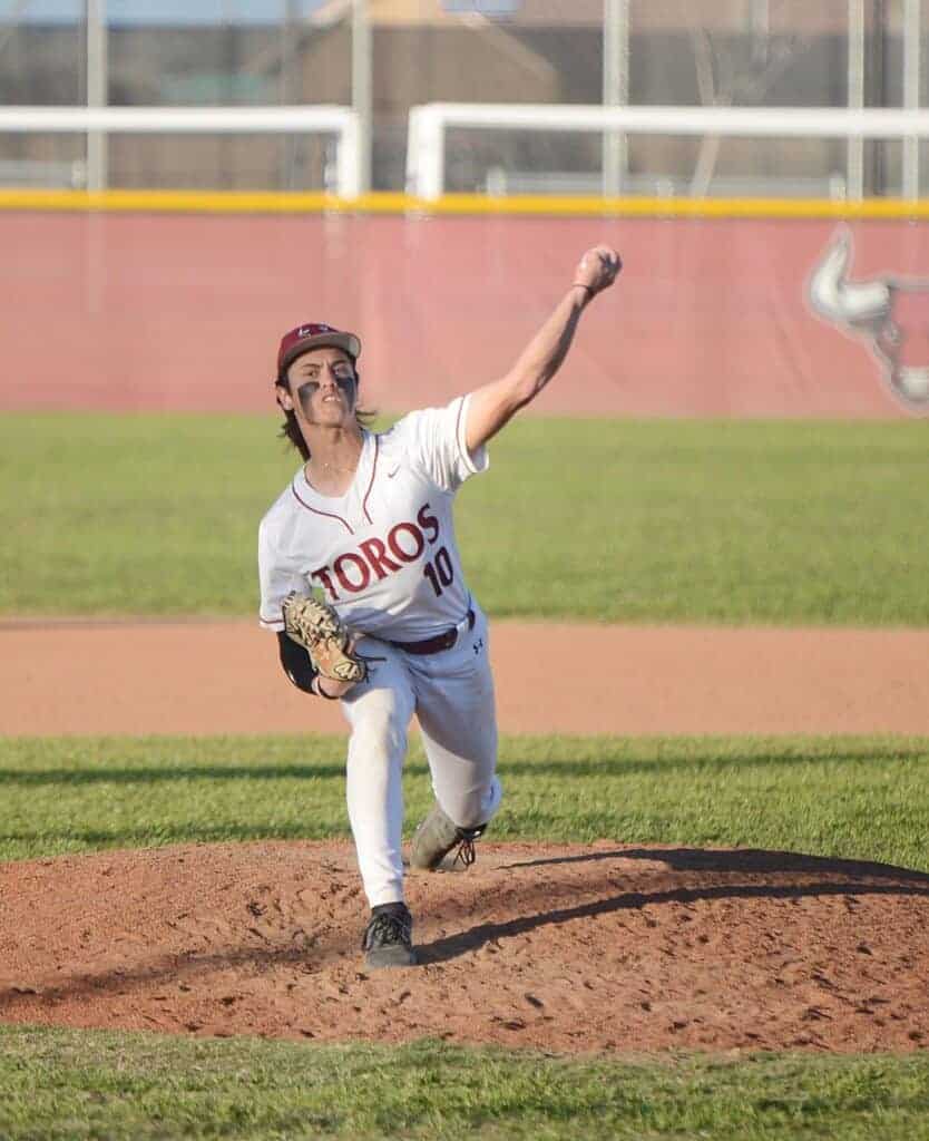 Photo - Matilda Torres’ Will Valmonte throws a pitch during Thursday’s 1-0 victory over Firebaugh. Valmonte threw 6 2/3 hitless innings in the victory. He also had three hits and drove in the only run of the game.