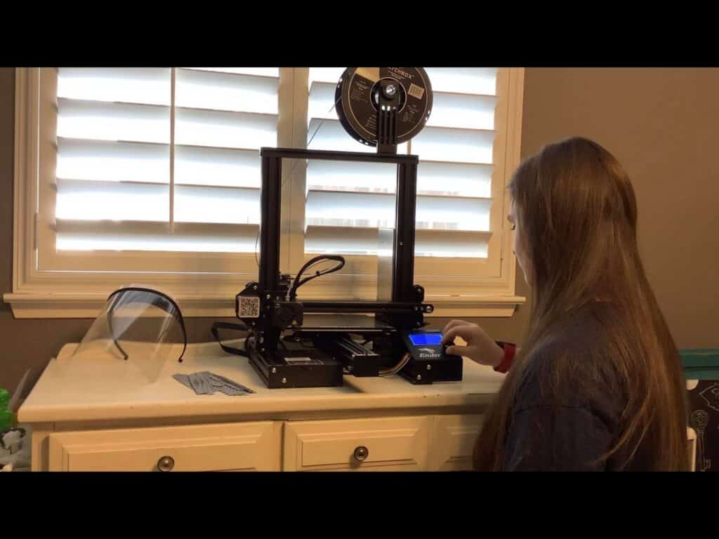 Photo - Halle Freitas uses her 3-D printer to make ear savers for first responders. Freitas says she’s happy to know her efforts are helping to make a difference in the community.
