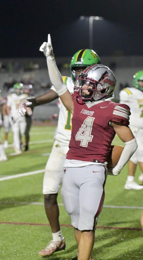 Photo - Torres receiver Jordan Garcia points to the sky after scoring one of his two touchdowns in Friday’s 46-14 loss to the Roosevelt Rough Riders. 