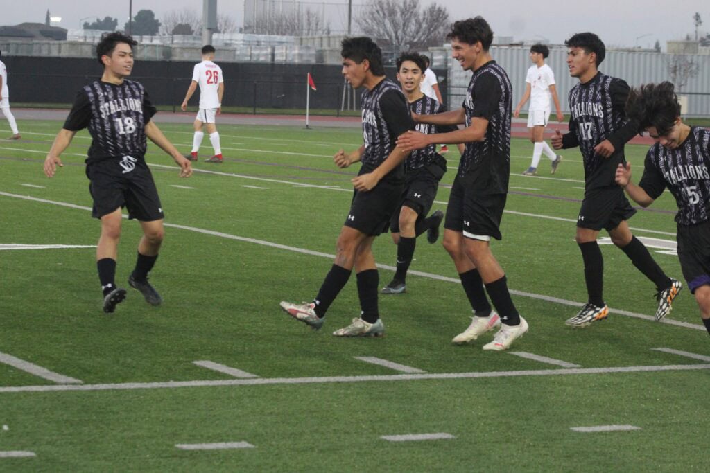 Photo - Madera South’s Raul Arzola celebrates his first-half goal to give the Stallions an early lead over the Sanger Apaches on Wednesday.