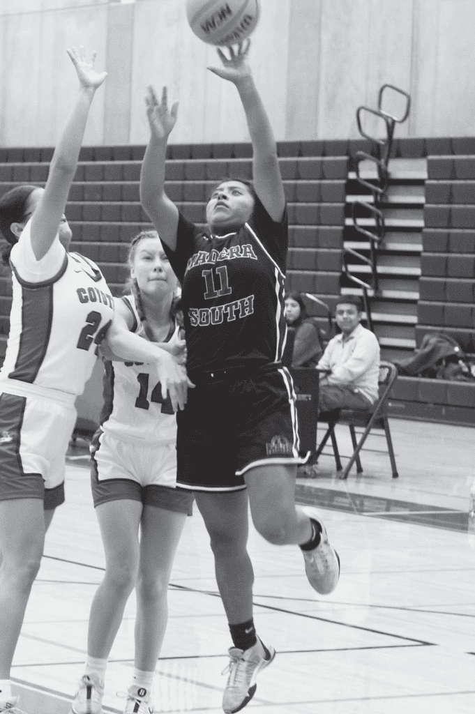 Photo - Madera South's Mayrlin Vasquez drives the lane for a bucket. She led the Stallions with 16 points in a fifth place game victory over Ridgeview. She was an All-Tournament selection.