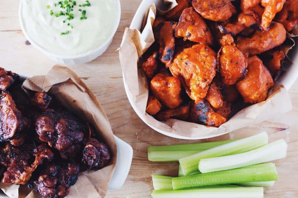 Photo - Cauliflower florets (right) can be used as a type of meatless hot wings. They are not just for vegetarians; everyone should at least give them a try.