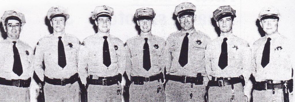 Photo - Ernie Fernandez, shown here on the far right, quickly found out how dangerous a policeman’s life was, especially at night. In March 1947, he and his partner, John Voith, apprehended a pair of burglars after a wild car chase complete with blazing pistols.