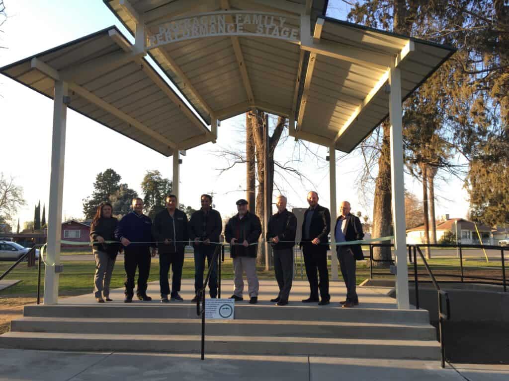 From left are: Joann McClendon, city clerk; Dave Riviere, chief of police; Ray Barragan, Jr., City Council member and current mayor pro tem; Waseem Ahmed, city council member; Dennis Haworth, City Council member and current mayor; Brian Haddix, city administrator; Jason Rogers, director of Public Works; and David Ritchie, city attorney. Photo - Chowchilla council dedicates stage to Barragan family