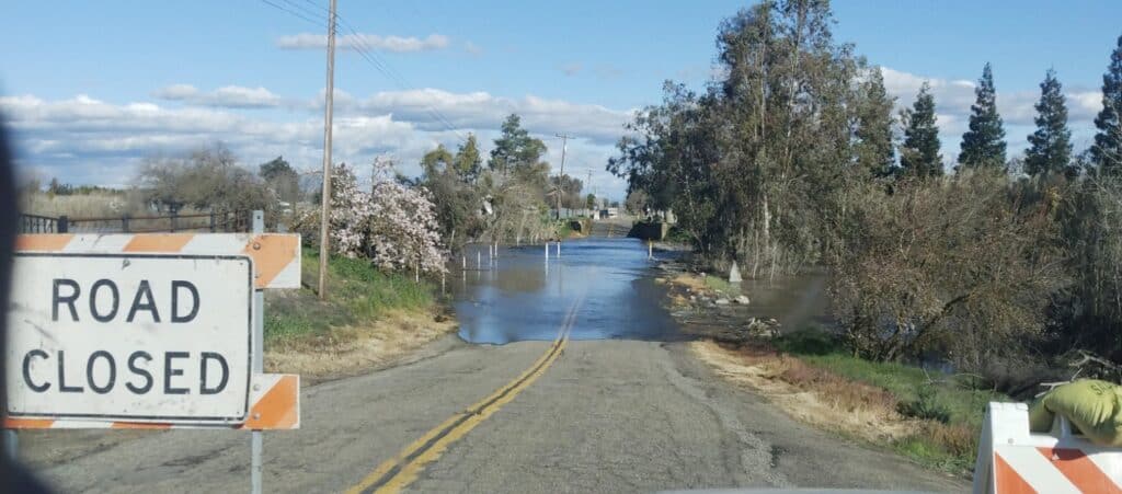 Photo - Avenue 23 1/2, west of Road 16 in Chowchilla, is closed due to flooding.