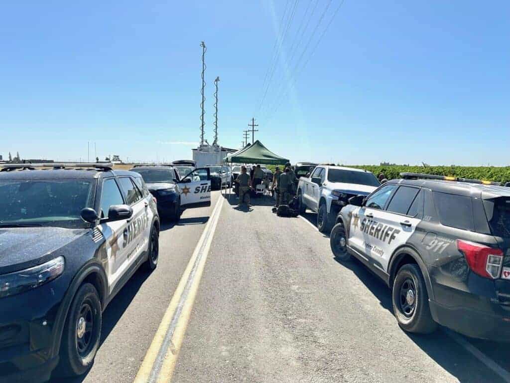 Photo - Madera County Sheriff’s Office sets up a command post to search for a kidnapping suspect. The MCSO searched for five hours before concluding its search. The suspect is still at-large.