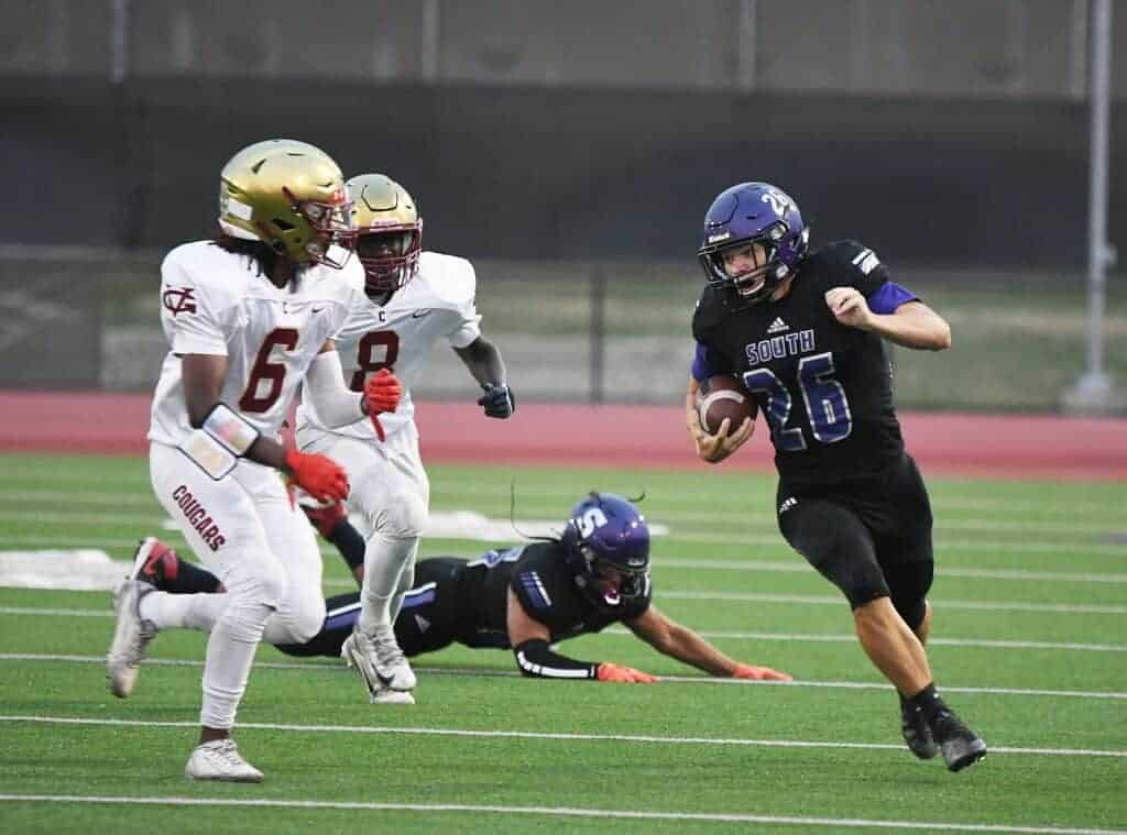 Photo - Madera South’s Tayte Grantham prepares for contact during Friday’s victory over Golden Valley. He rushed for 46 yards to help the Stallions’ ground game control the clock.