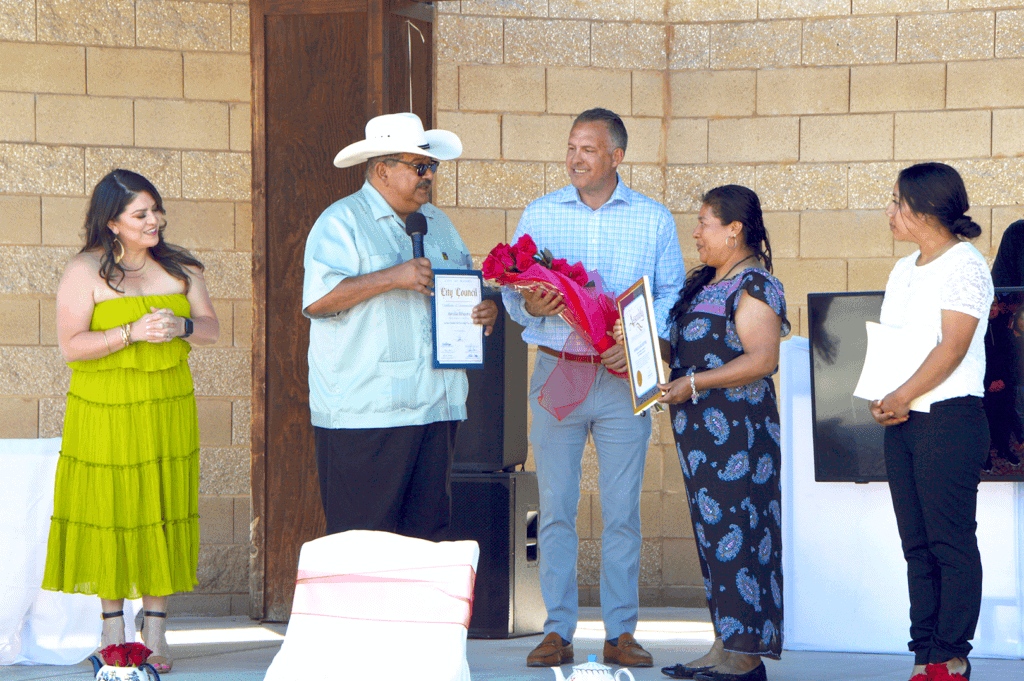 Photo - Madera Mayor Santos Garcia presents Latinas Unidas de Madera Mother of the Year recipient Aurelia Sylvester with a proclamation from the city at the Mother’s Day Tea.