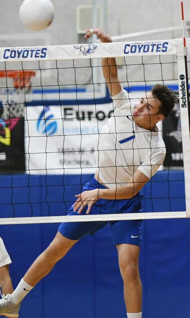 Photo - Madera’s Chandler Fowler goes up to put down one of his team-high 17 kills during Tuesday’s four-set loss to Central.