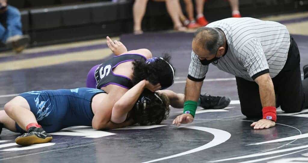 Photo - Madera South senior Andrew Barajas closes out his high school wrestling career with a first period pin at 126 pounds against Yosemite on Thursday. Barajas was one of three seniors honored before the match for the Stallions.