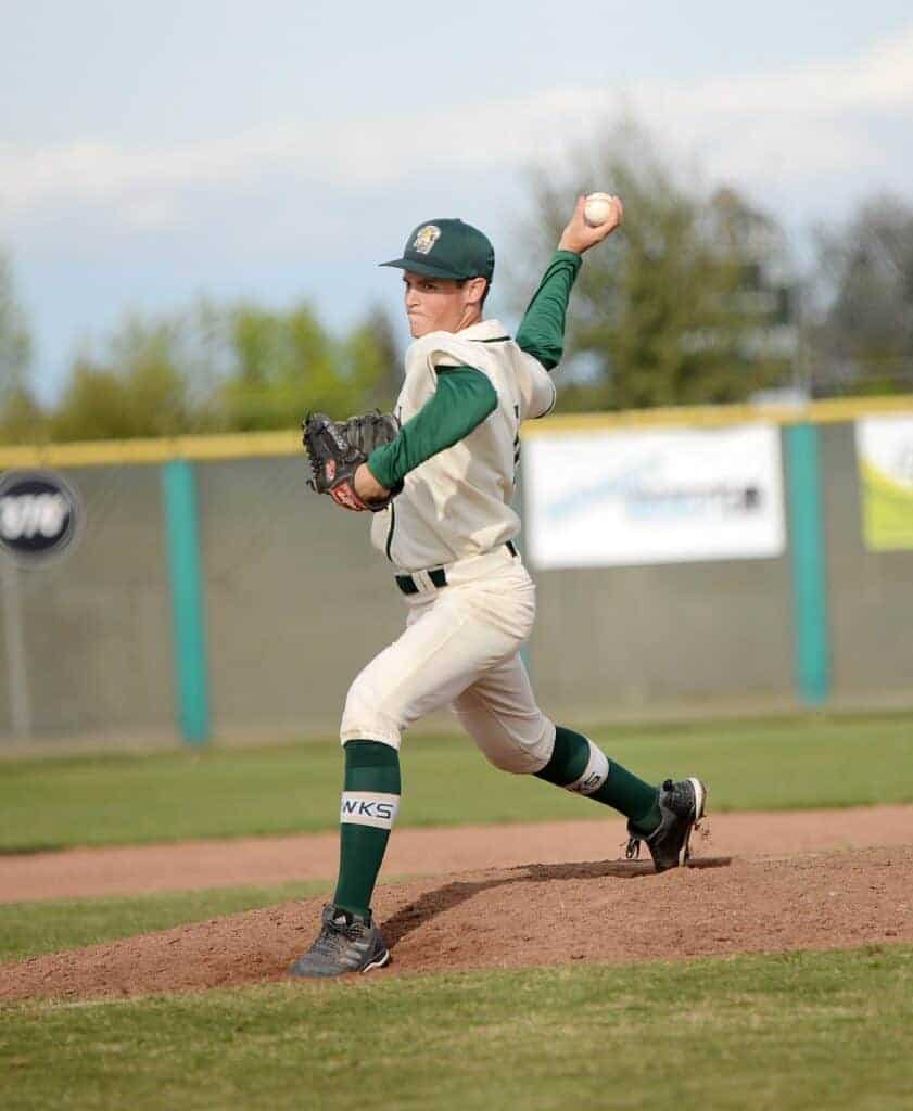 Photo - Liberty’s Quaid Copher throws a pitch during Wednesday’s 10-1 victory over Dinuba. Copher allowed just three hits in a complete game victory. He also scored a run.