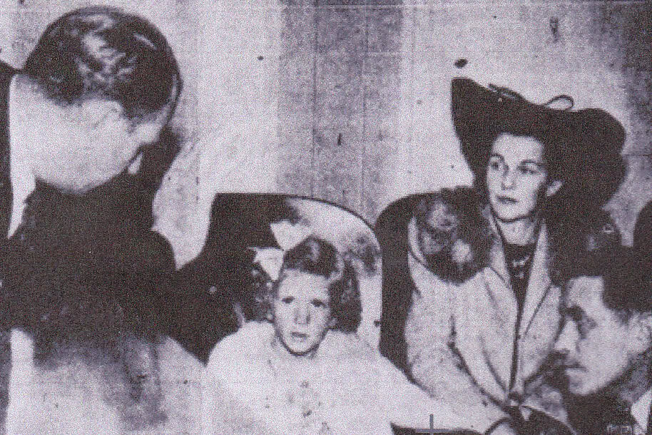 Photo - Six-year-old Janice Hake is seen here telling San Francisco court officials how her father murdered her mother in 1942.
