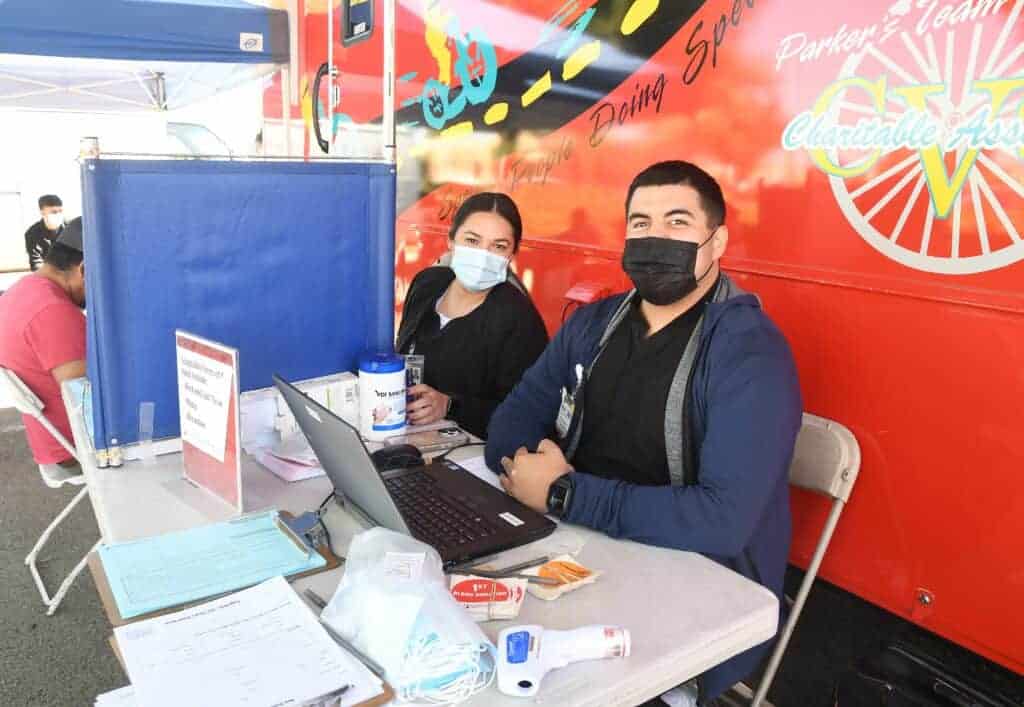 Photo - Kassandra Rodriguez and Rene Resendez of the Central California Blood Center register blood donors during a blood drive hosted by the Madera Mountain Mike’s Pizza.