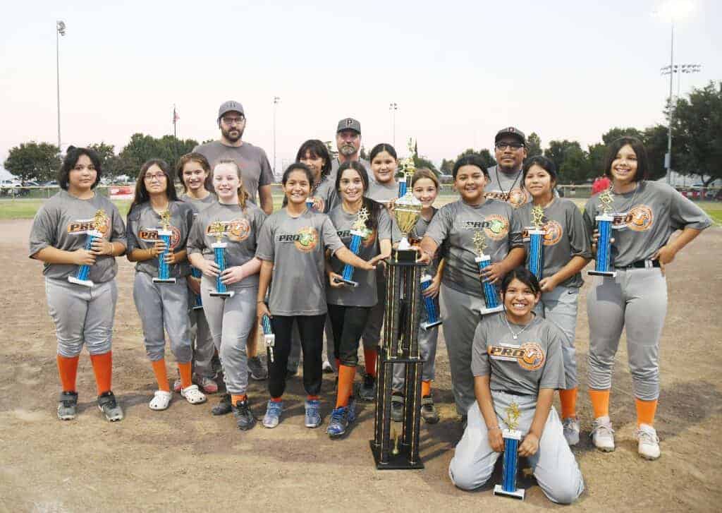 Photo - Pro T’s celebrates a 4-3 victory over Mazon Trucking for the Madera National Little League Softball Championship.