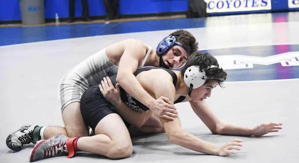 Madera’s Rudy Paredes (top) tries to work Madera South’s Jaime Garcia into back points during Wednesday dual meet. Paredes picked up the win for a 37-31 dual meet victory to give Madera its ninth straight County/Metro Athletic Conference championship.