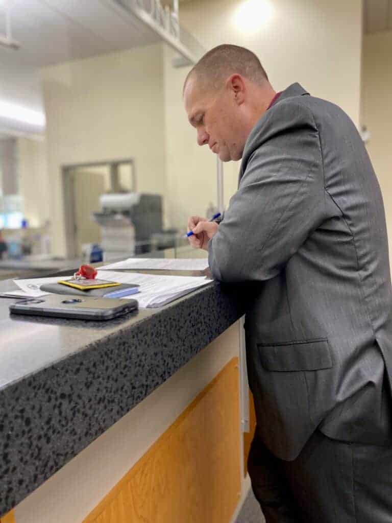 Photo - Madera County Sheriff Tyson Pogue fills out paperwork to begin his election run for the Sheriff position.