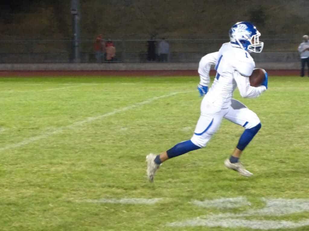 Photo - Madera receiver J.J. Espinoza breaks free in the open field during Friday’s 34-14 victory over Atascadero.