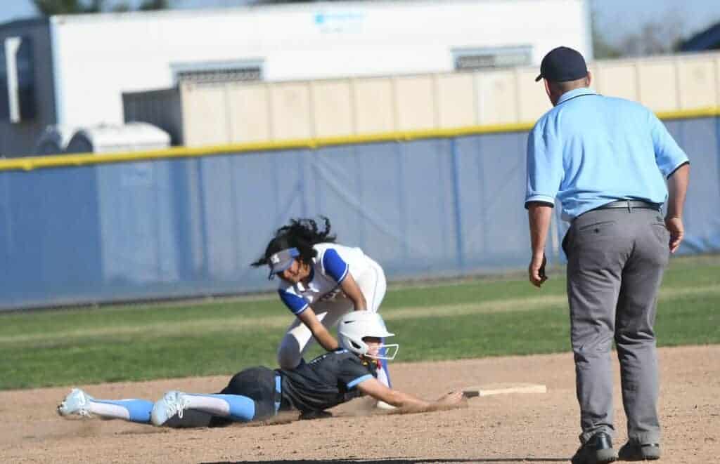 Photo - Madera shortstop Kailea Ricks tags out a Clovis North runner trying to head back to second in the fifth inning Thursday.