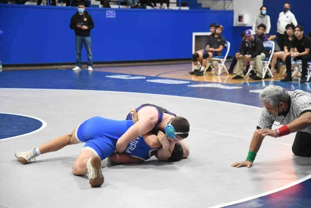 Photo - Madera South 160-pounder Isaiah Garza works Madera’s Julian Hernandez into a pin during last week’s victory in Joe Flores Gym.