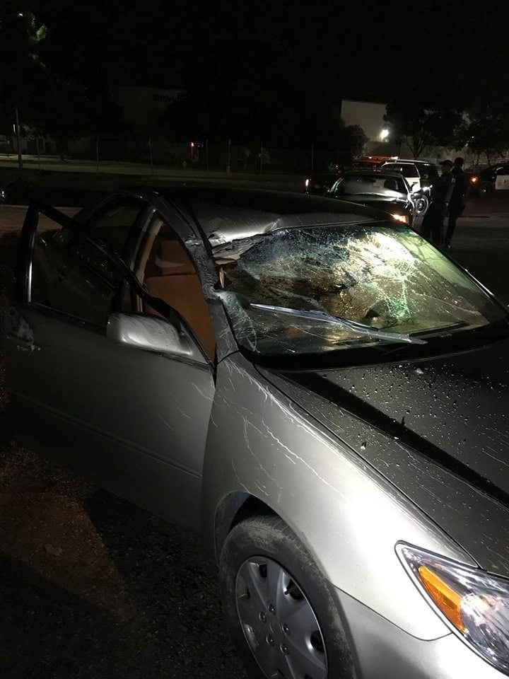 Photo - The wrecked silver sedan driven by Oksana Reynoso sits in a parking lot after crashing into multiple vehicles and objects early Thursday morning in the 1800 block of West Almond Avenue. Reynoso was arrested on suspicion of DUI.