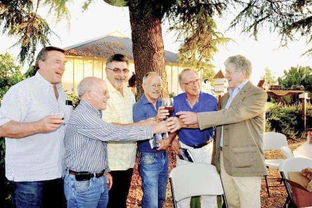 Photo - Frank Bergon, far right, enjoys a toast with a group of Maderans who supplied him with memories, stories, or other informational details about the Valley.