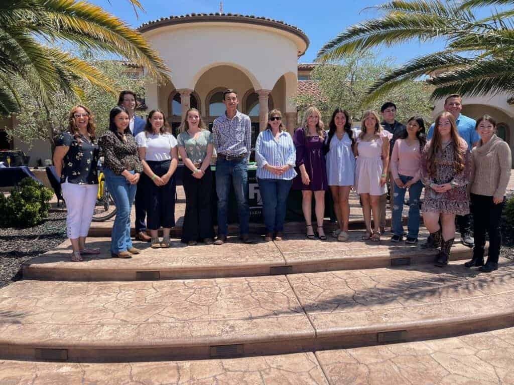 Photo - Some of the recipients of the Madera County Farm Bureau scholarships stand with members of the Farm Bureau board at the Mimosas with the Mahil scholarship fundraising event on May 7.