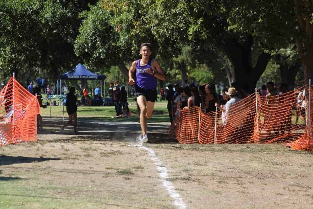 Photo - Madera South’s Seth Garcia leads his race to win an individual championship at the Madera Invitational on Saturday at Town and Country Park.