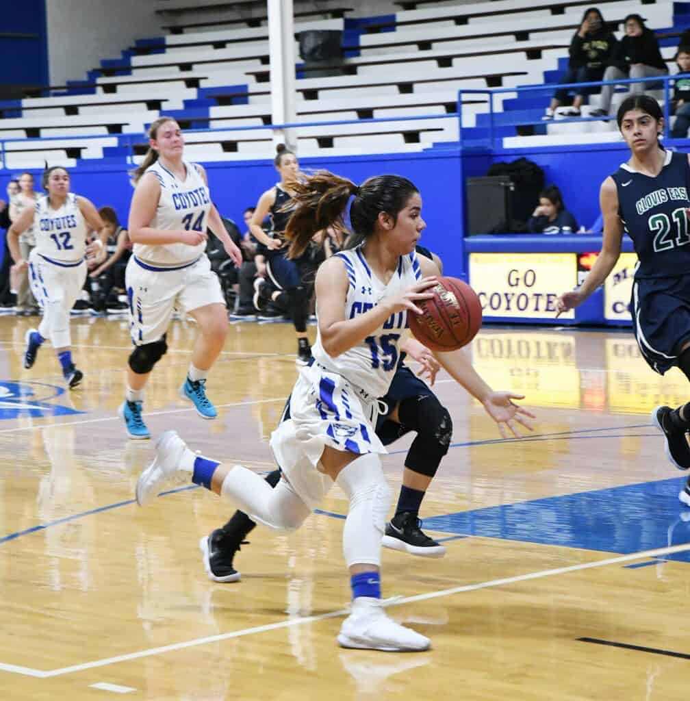 Photo - Madera’s Camile DeAnda drives the lane against Clovis East. She scored seven points in the loss.