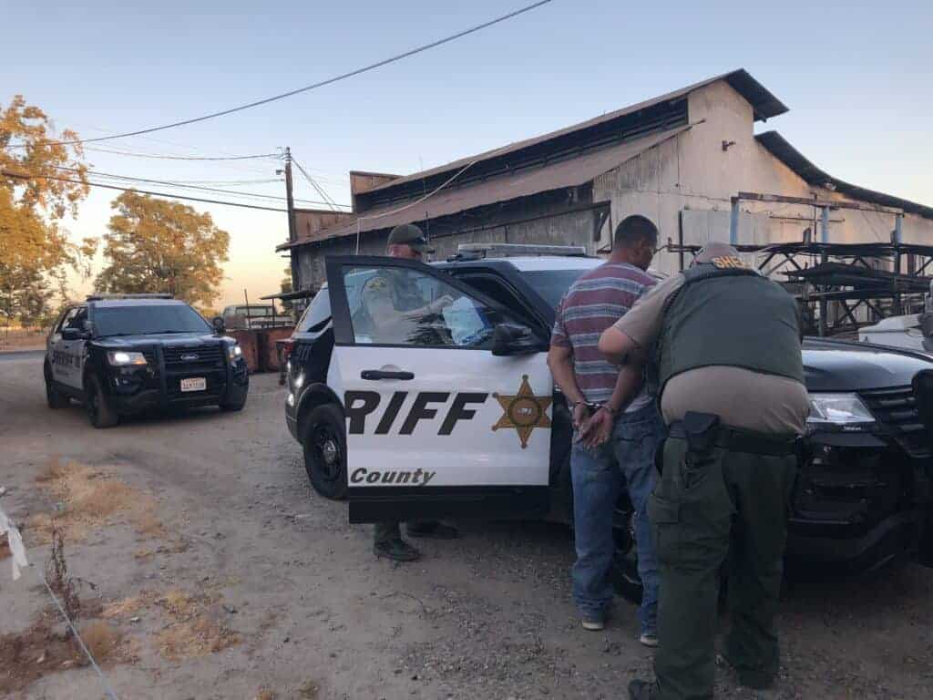Madera County sheriff’s deputies detain burglary suspect Carlos Castro after being dispatched to a vacant home. Photo - Madera County Sheriff’s Department