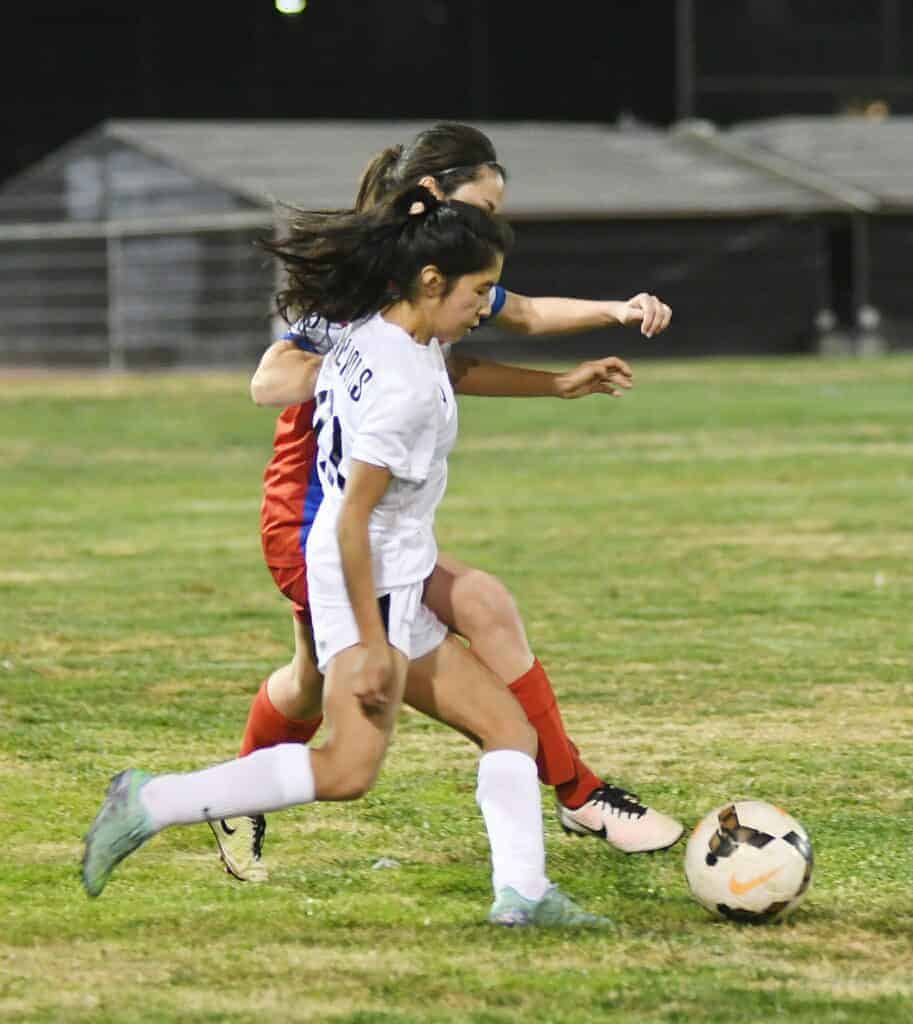 Photo - Madera South’s Neveah Alonzo battles for possession with Buchanan during Friday’s loss to the Bears in non-conference action.