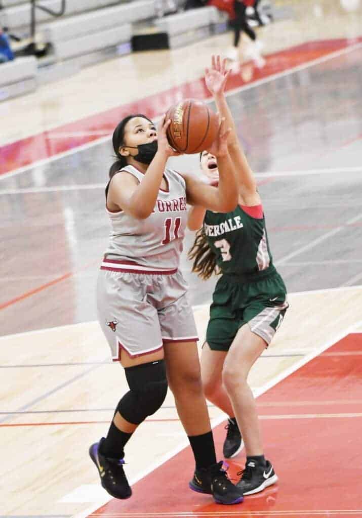 Photo - Matilda Torres’ Layla Webster (11) goes up for a shot during Friday’s rout of the Riverdale Cowgirls.