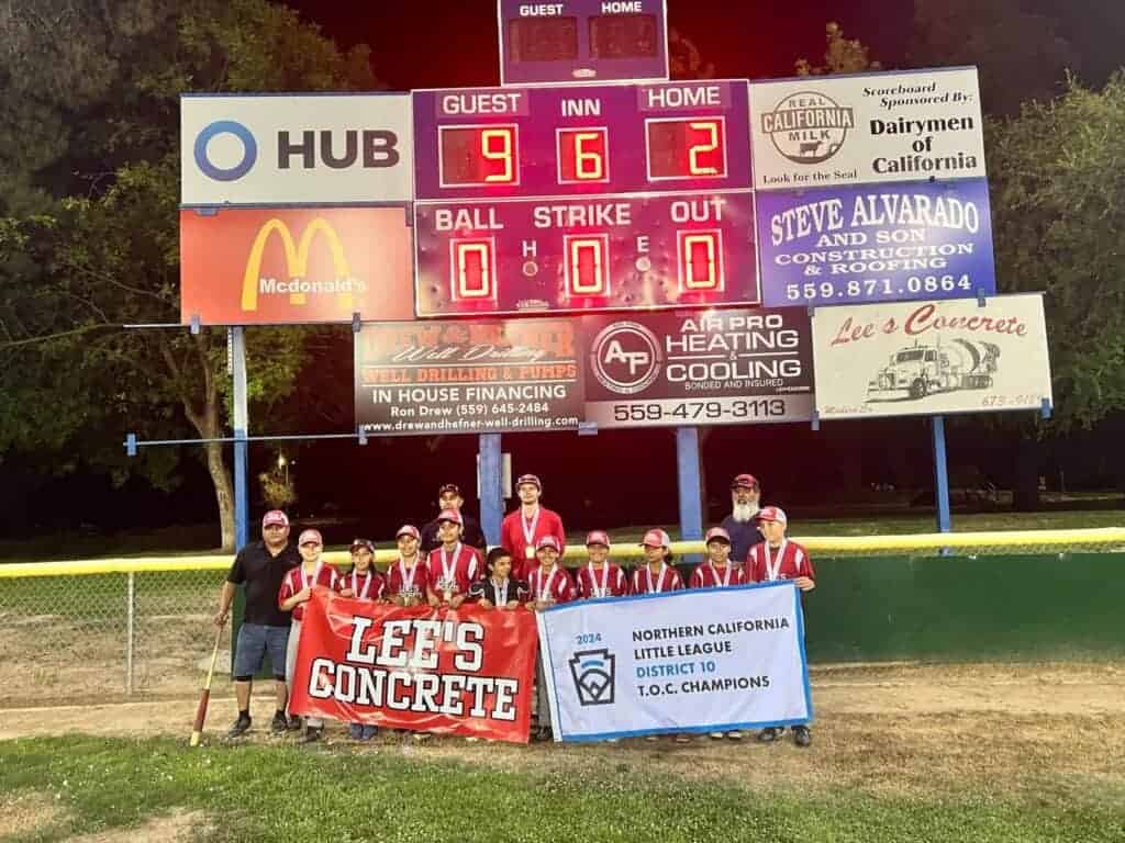 Photo - The scoreboard tells the story for Madera American Little League champions, Lee’s Concrete. They defeated the Sunnyside champions, Angels, 9-2, on Saturday at capture the District 10 Tournament of Champions.