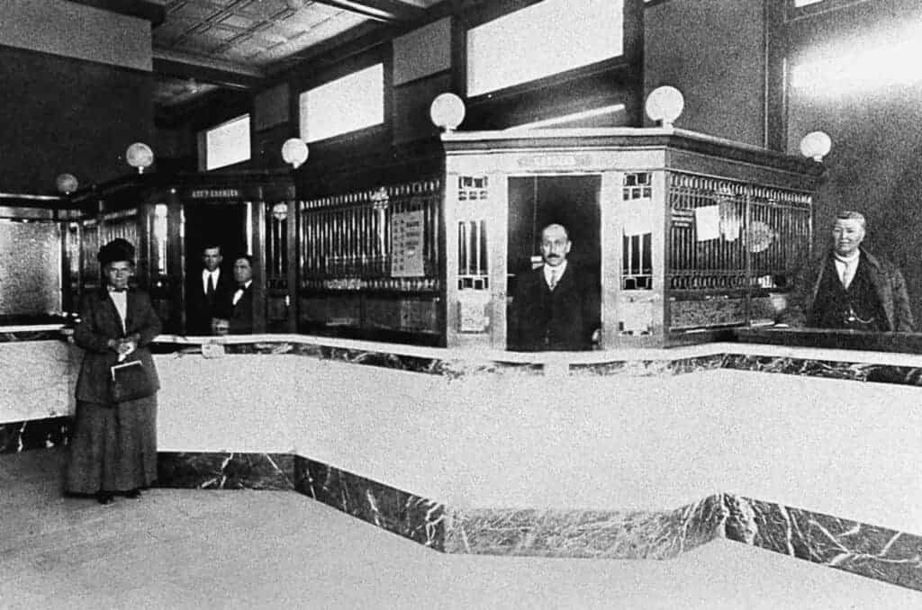 Photo - These Maderans at the First National Bank show some of the “respectable” side of town. Just behind this building on D Street, however was Kate’s Ball Throwing Gallery, which attracted a much different clientele.
