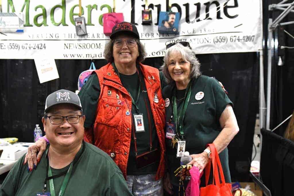 Photo - From left are Madera Tribune Sports Editor Tyler Takeda, Tribune columnist Tami Jo Nix and Madera Tribune CFO Nancy Simpson at the Tribune’s booth during the 2023 Madera Fair.