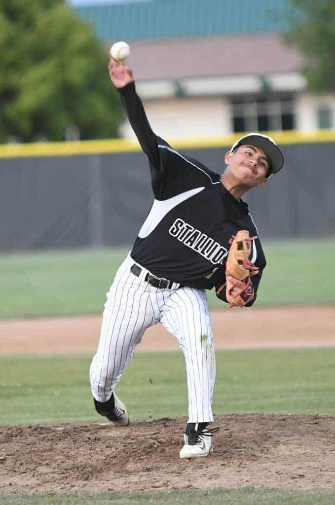 Photo - Madera South’s Bryan Malagon throws a pitch during an 8-6 loss to Edison on Thursday. Malagon didn’t allow an earned run over the final 5 2/3 innings and retired the final 10 Edison batters in order.