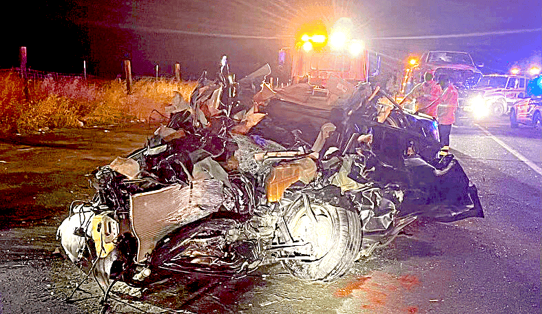 Photo - Remains of a Dodge Charger sits on the side of State Route 145 after a multi-car accident Sunday. Four cars were involved in the accident and also had one fatality.