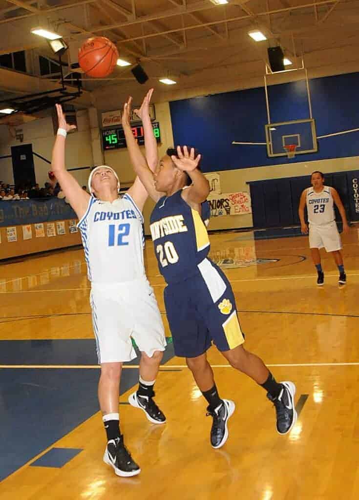 Photo - Madera’s Jenny Gallegos battles for a loose ball during a 2012 victory over the Sunnyside Wildcats on Senior Night in Joe Flores Gym.