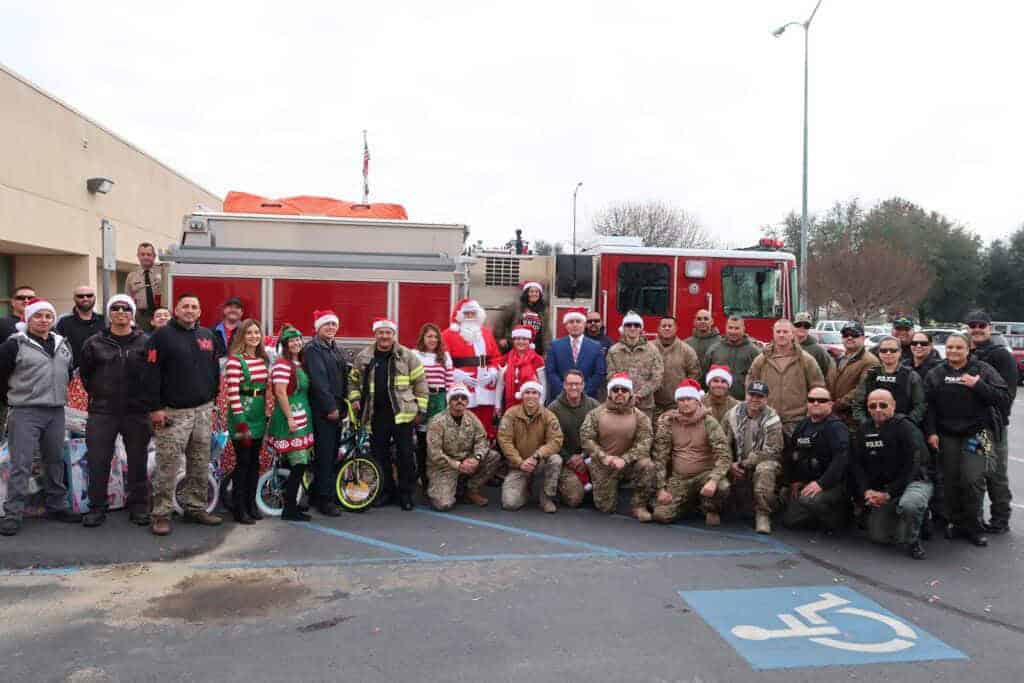 Photo - Staff members of the Central California Women’s Facility in Chowchilla, when they set out Dec. 11 to take toys to children at two schools and Valley Children’s Hospital.