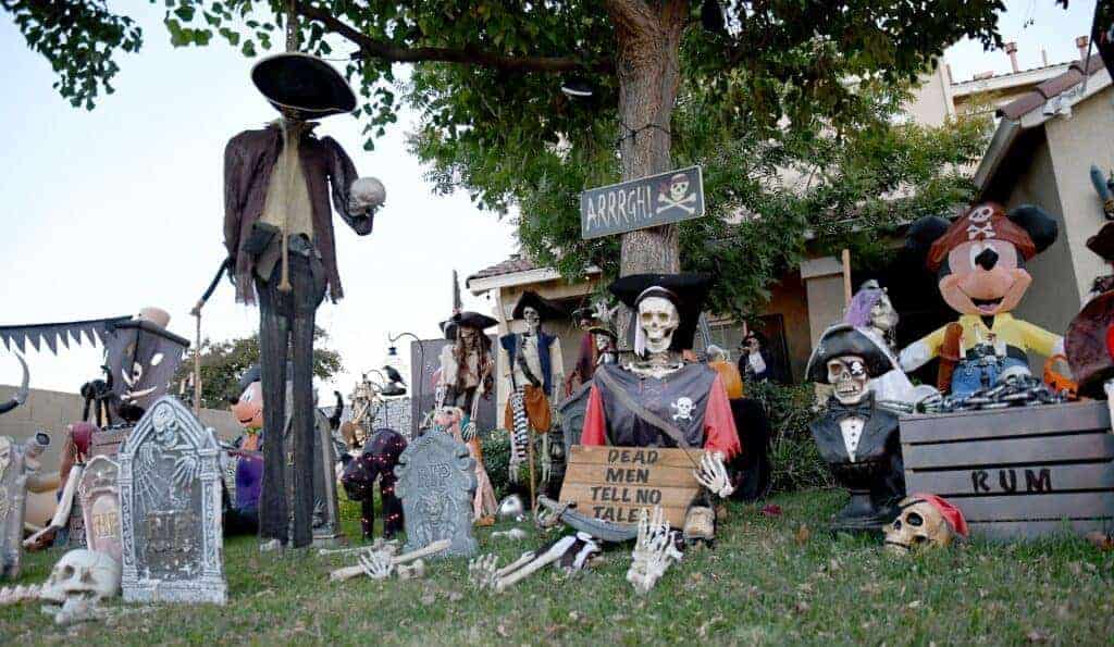 Photo - Pirate figures dominate the lawn of Jeff Cox’ home on Lemon Tree Drive. The house, known for elaborate displays during Christmas, has taken on a different vibe in celebration of Halloween.