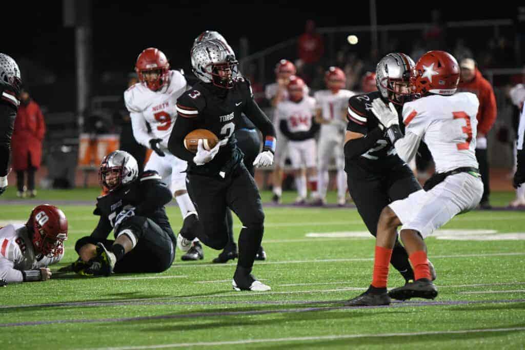 Photo - Matilda Torres’ Joseph Bass breaks free for a touchdown run during Friday’s 28-14 victory over North in the Div. IV quarterfinals.