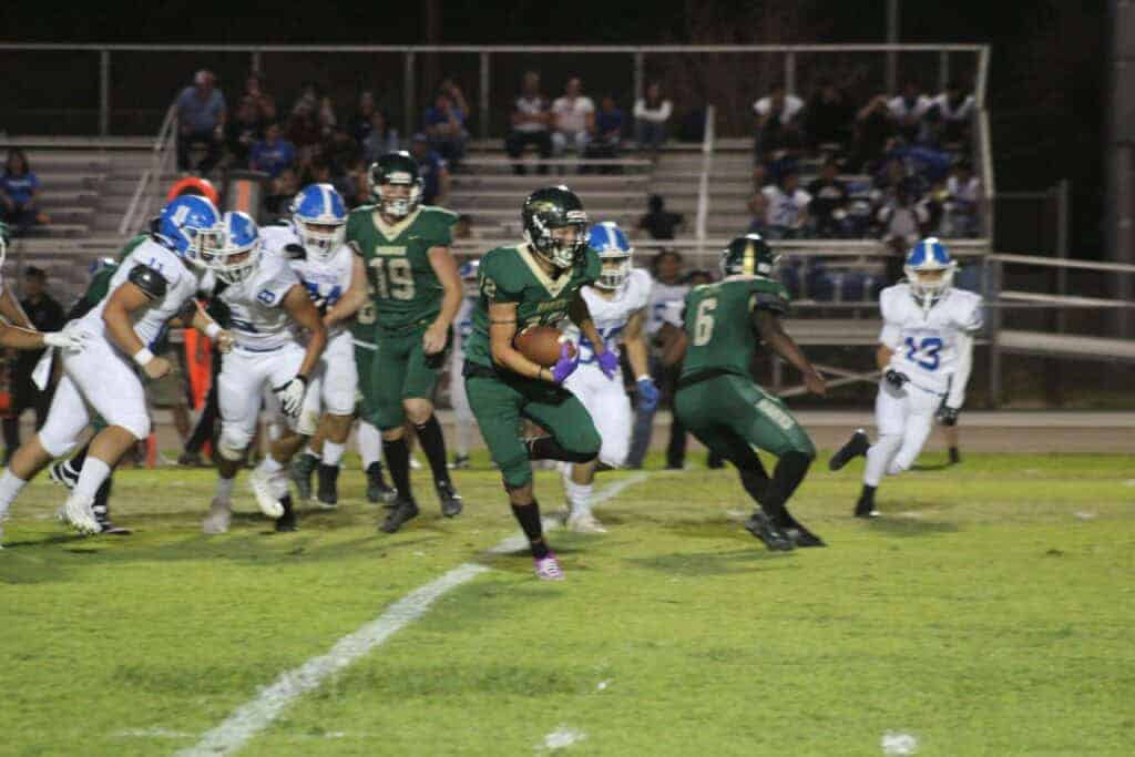 Photo - Liberty’s Shane Williams breaks into the open field to score on a 44-yard touchdown run, his second of four touchdowns in Liberty’s 56-21 win Friday over Caruthers.