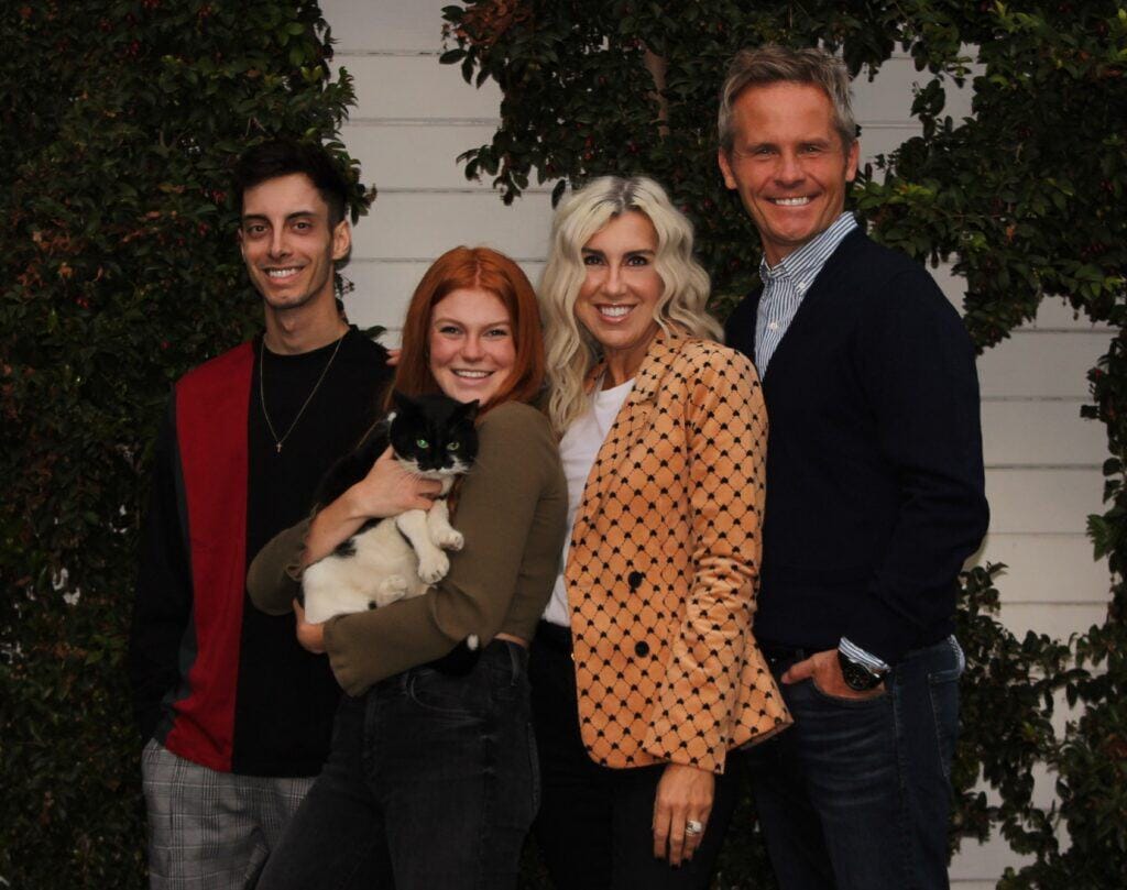Photo - Former Madera graduate Leslie Moore stands with her family outside her home in Northern California. After helping keep the Sacramento Kings in the state’s capital, Moore is Vice President of Juniper Networks in charge of Global Communications.