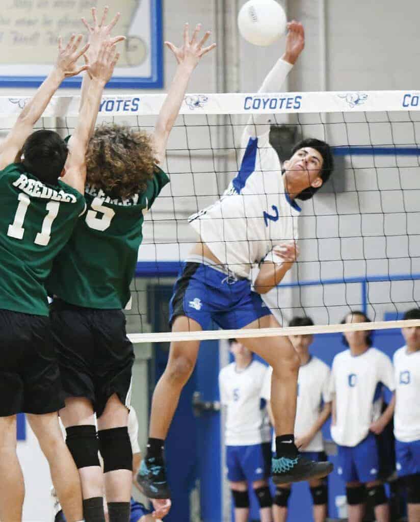Photo - Madera’s Angel Leon reaches up for a kill during Tuesday’s season-opening match against Reedley.