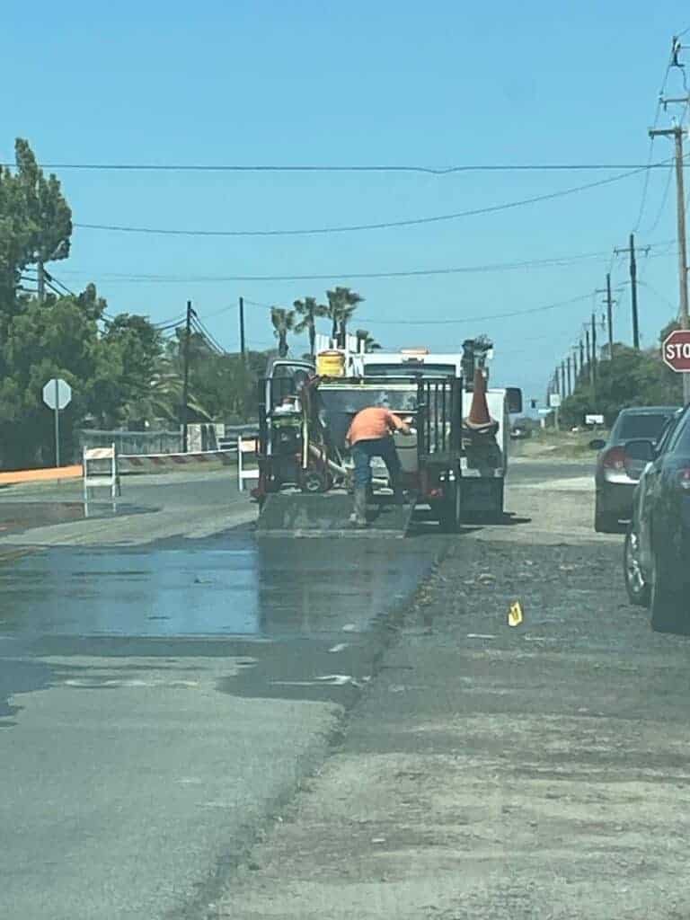 Photo - Madera city crews put the finishing touches on road work after repairing a water main leak on Adell and D streets last week.