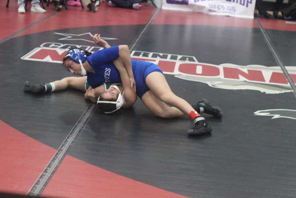 Photo - Madera’s Madison Avila works her quarterfinal opponent into near fall points during Friday’s Chukchansi Invitational. Avila, who is ranked No. 1 in the state, won the 104-pound division.